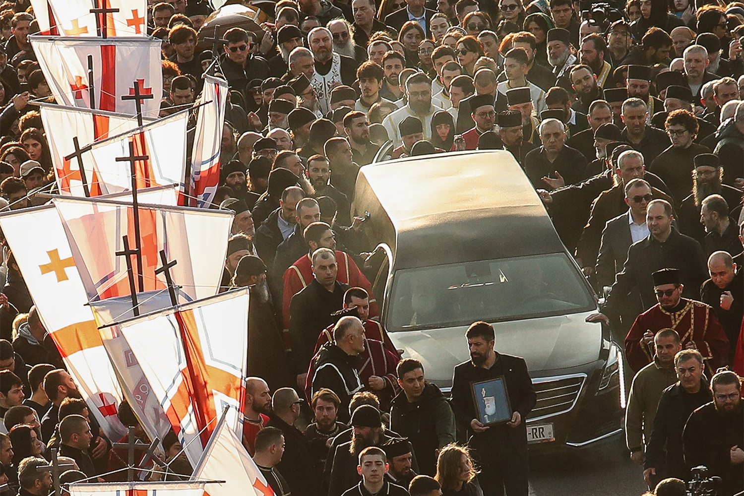 За время патриаршества Илии II страна пережила распад СССР и связанные с этим экономические и демографические проблемы. Он пытался помочь верующим преодолеть эти испытания, в частности, стал крестным отцом примерно 50 000 младенцам. Патриарх крестил третьих и последующих детей венчанных родителей, чтобы поддержать рождаемость в Грузии.